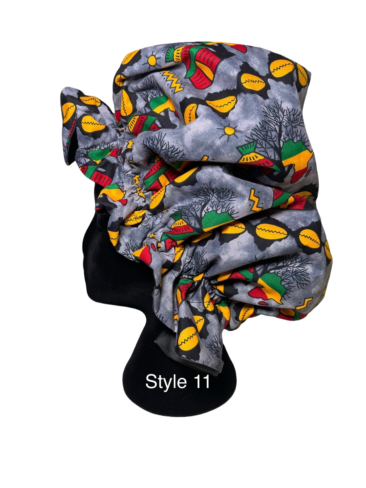 A gray patterned bonnet displayed on a black mannequin head against a white background, with the text 'Style 11' printed on the mannequin.