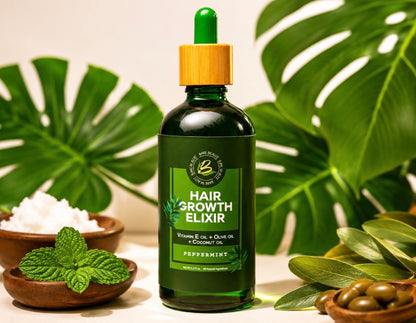 A bottle of hair growth elixir with a green dropper cap and a light wood-toned collar, set against a styled background with large green monstera leaves, mint leaves, and small bowls of ingredients.